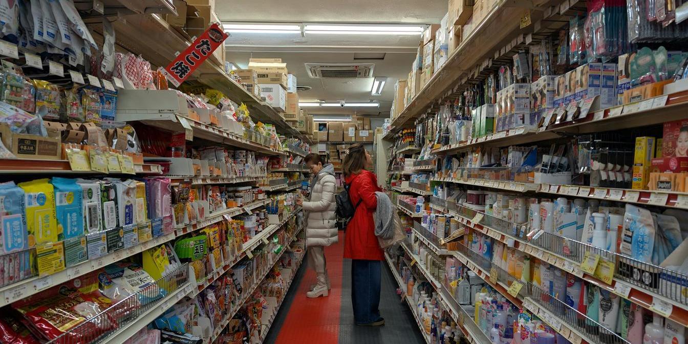 Shopper checking the label of an imported Iranian grocery product