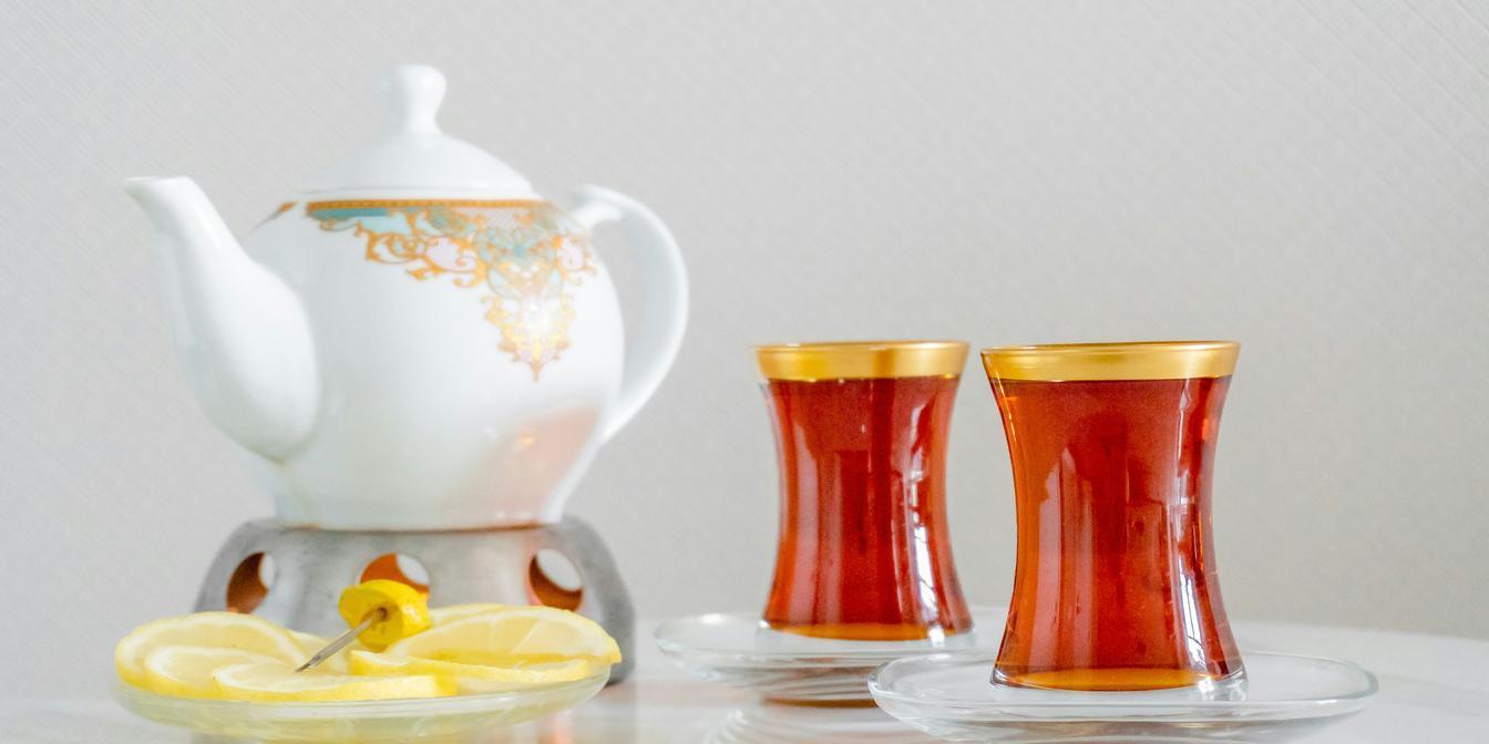 Persian tea served with dates, nuts and sweets