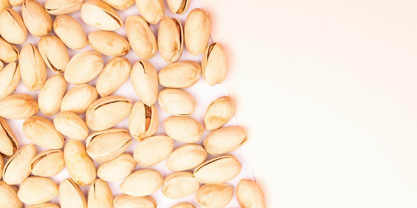 A measured snack portion of shelled pistachios