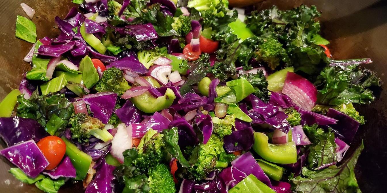 Grain and vegetable salad topped with chopped pistachios