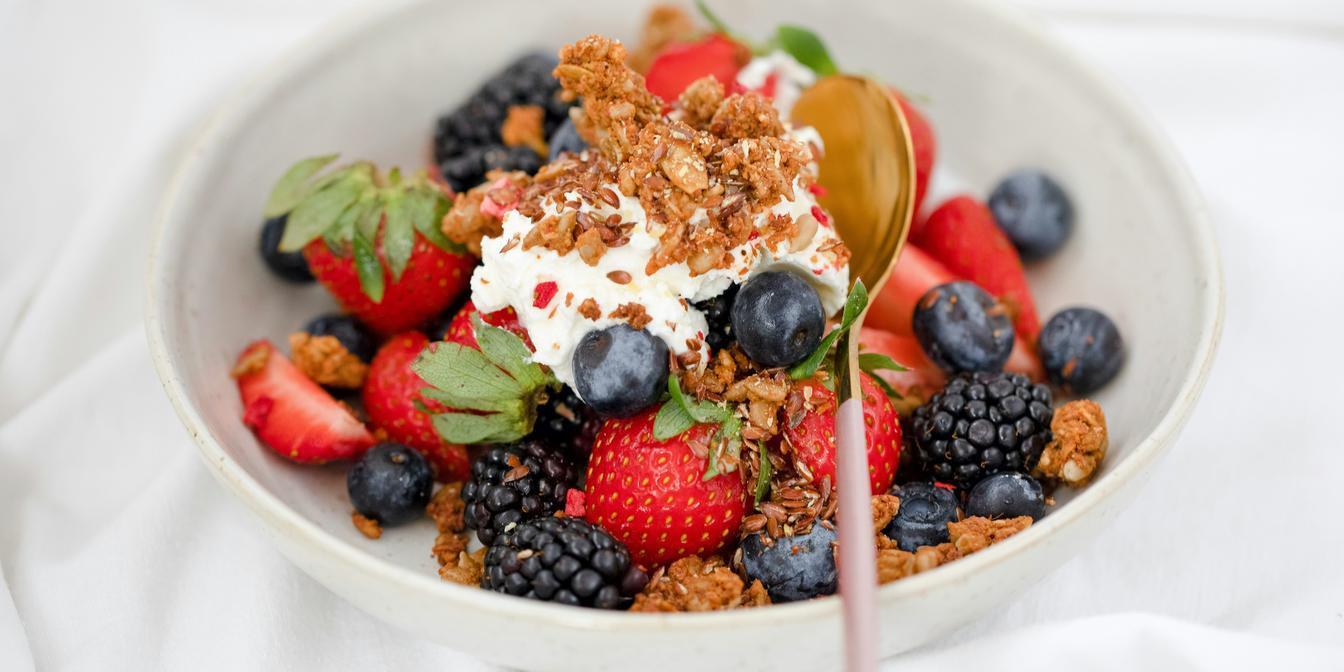 Small dried-plum portion paired with plain yogurt and walnuts