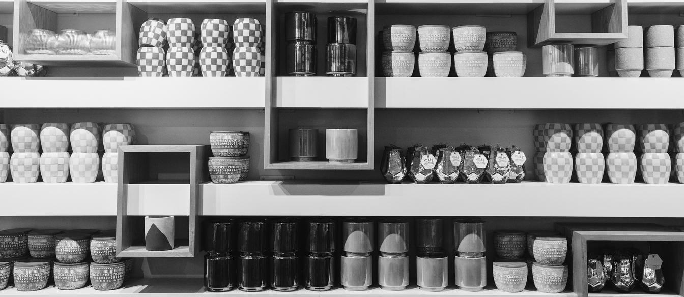 Organised pantry cupboard with dry ingredients, tins and cooking condiments
