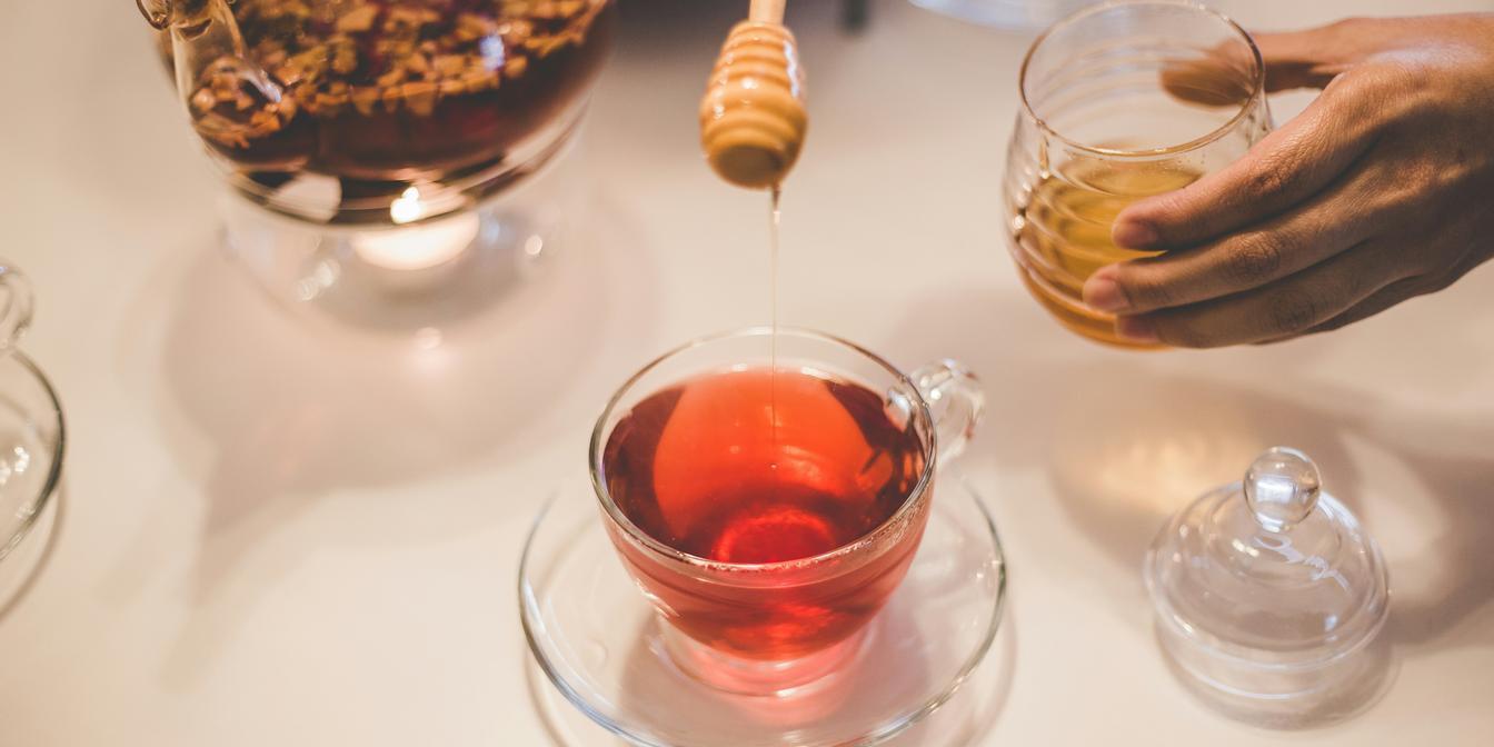 Persian black tea served in a glass with sugar cubes