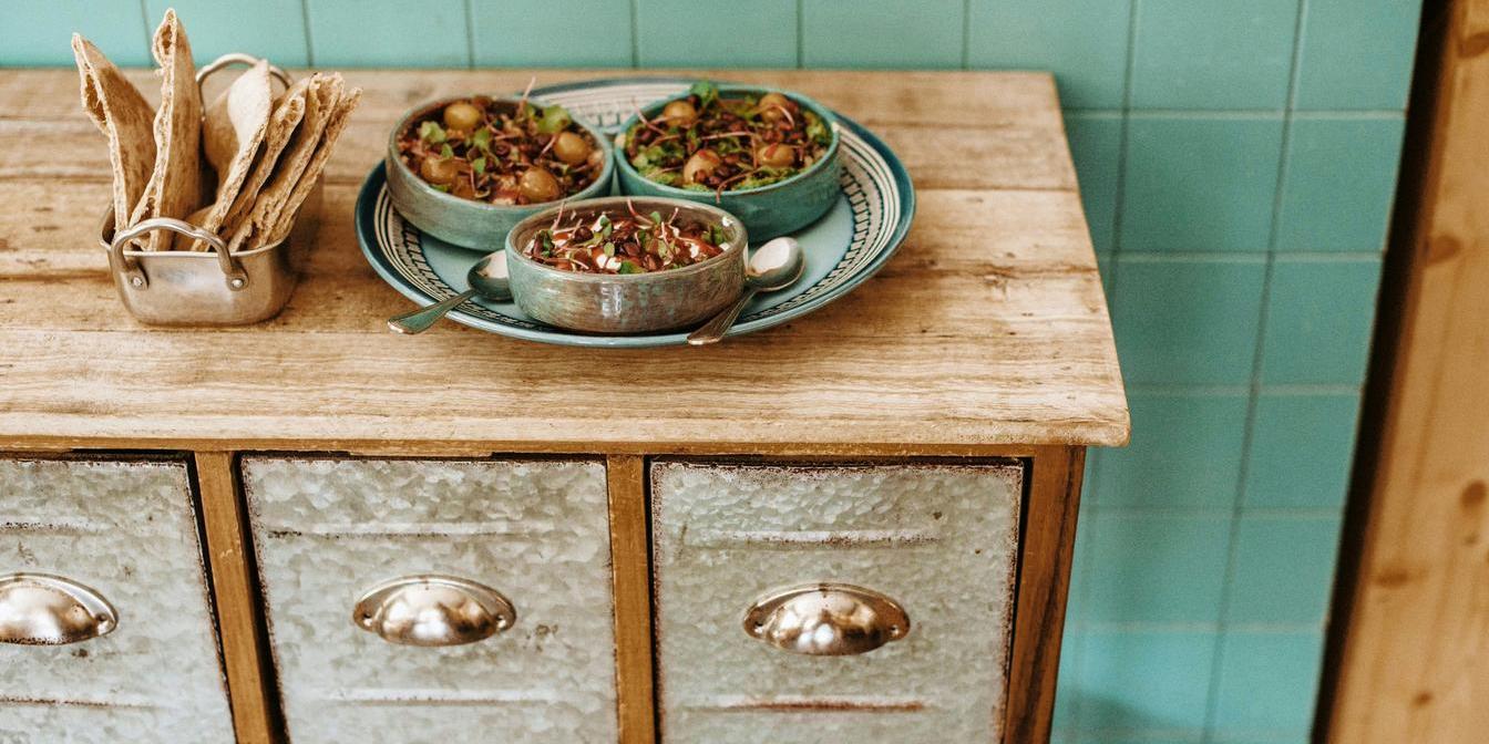 Warm Iranian breakfast dishes with omelette and lentil stew