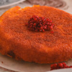 Golden tahdig served with fluffy Persian long-grain rice